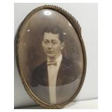 Antique framed image of a young man