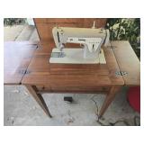 Singer sewing machine with cabinet