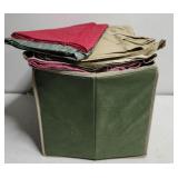 Huge green bin of different colors of fabric