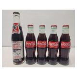 5 glass bottle Coca-Colas
