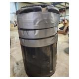 Black bin filled to the top with bolts