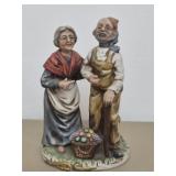 Old man and woman with basket figurine