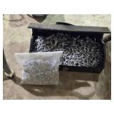 Tools box full of misc screws