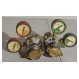 Two oxygen and acetylene regulators