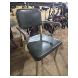 Aluminum chair with green cushion