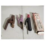 Electrode holders and grounding clamps