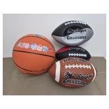 3 footballs and one basketball