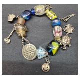 Glass beaded bracelet w sterling silver charms