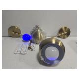 Pair of gold color light fixtures with RGB lights