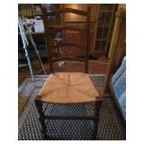 Antique ladder back chair with straw seat