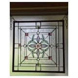 Stained glass panel a central floral motif