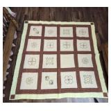 Yellow and brown quilt