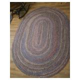 Oval knotted area rug