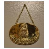 Brass welcome pineapple sign