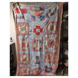 77' by 45' red and blue multi colored quilt