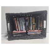 Black basket full of DVDs
