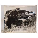 Vtg photo of police inspecting an engine