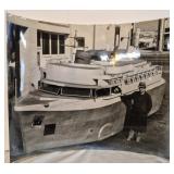 Photo of 2 men & a boat