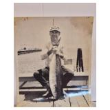 Vtg photo of a fisherman holding a fish