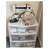White Sewing machine and plastic container full