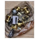 Estate lot of brass finish door knobs & latches