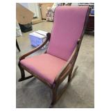 Pink upholstered rocking chair