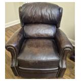 dark brown leather armchair that reclines