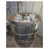 Barrel full of metal pipe fittings