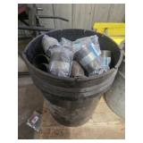 Bucket full of industrial fittings