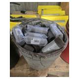 Bucket full of industrial pipe fittings