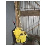 Yellow mop bucket with 2 mops