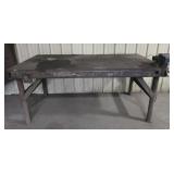 Solid thick steel table with vice