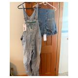 Torn overalls, denim jeans with significant wear