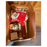 Skill saw, casserole dish, cabinet Christmas items