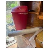 Landscape fabric, red trash can