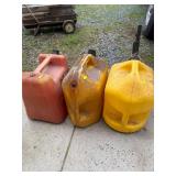 2 diesel cans one contains diesel, gas can