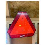 Slow moving vehicle sign