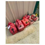 3 five-gallon & 3 2.5-gallon gas cans