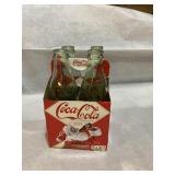 2012 reproduction four pack of 1900 Coke bottles