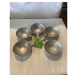 Collection of aluminum egg poaching cups