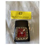 Black zippo lighter with red enamel flower
