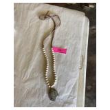 Leather strand necklace with light cream stone