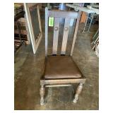 Wood dining chair with brown vinyl padded seat