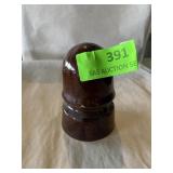 Brown ceramic insulator has small chip