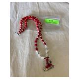 Red glass bead necklace with red hat pendant with