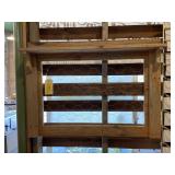 Wood hanging shelf with chicken wire on the front