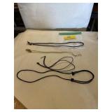 Two black necklaces and two eyeglass holders