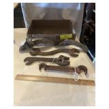 Assortment of antique tools and oil can spouts.