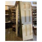 Vintage wood door with brass looking hardware. 24