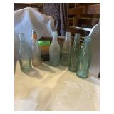 Texas, six pack.. assorted glass soda bottles,